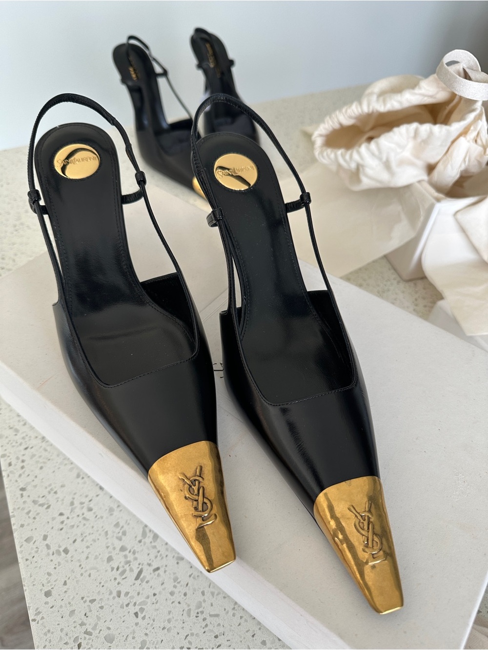 Saint Laurent Black Leather Slingback Pumps with Gold Toe Caps